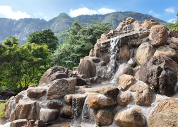 Miniature waterfalls within Seetharkundu Resorts grounds Kollengode