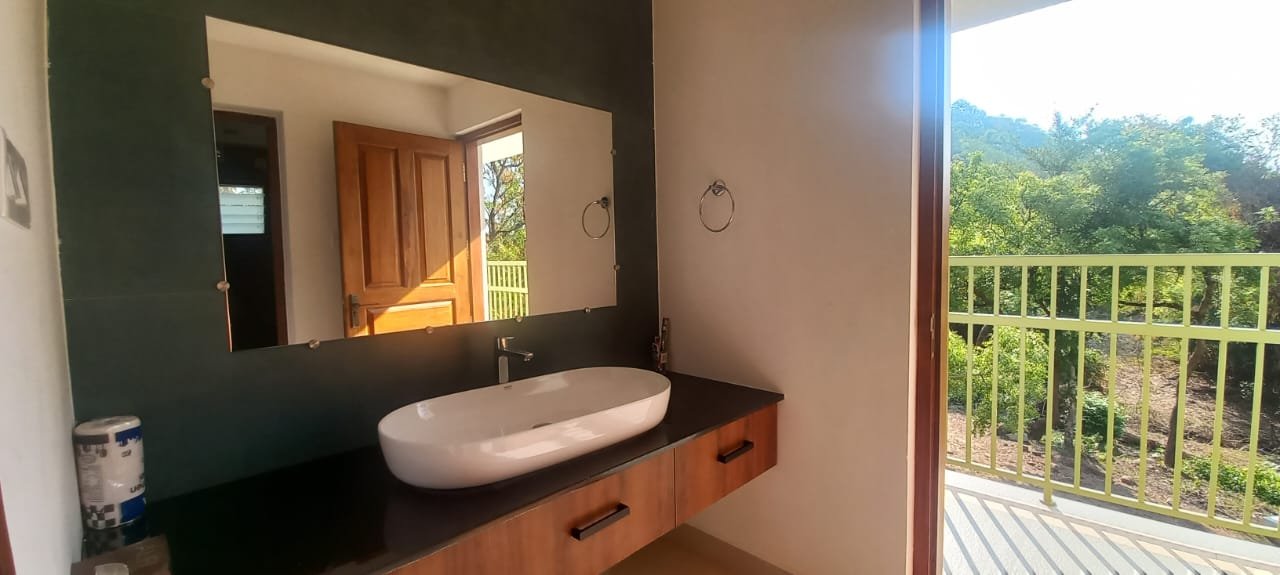 Kitchen and open balcony overlooking Nelliyampathy hills at Seetharkundu Resorts, Palakkad